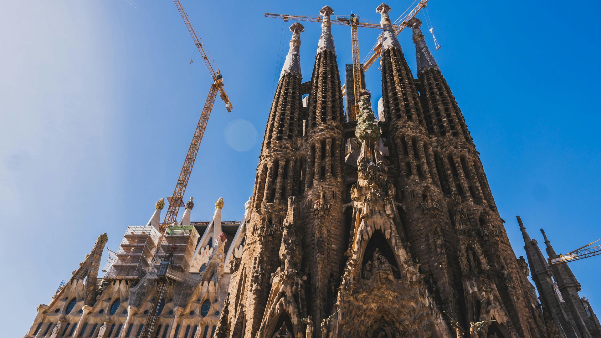 The Sagrada Familia in Barcelona with a blue sky in the background