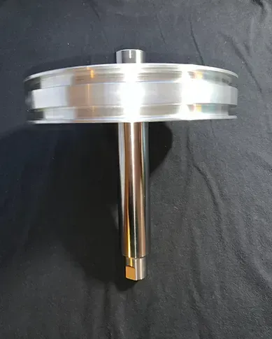 a metal object is sitting on top of a black cloth .