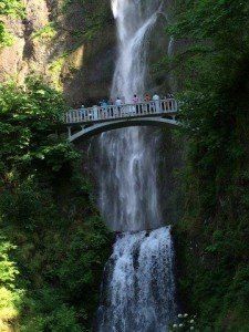 wooden bridge overlooking waterfall