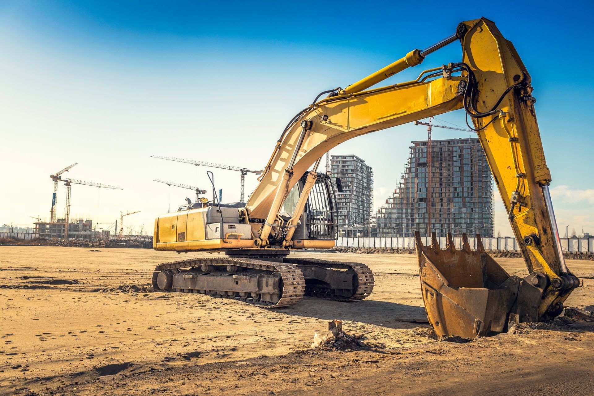 Yellow excavator on a construction site