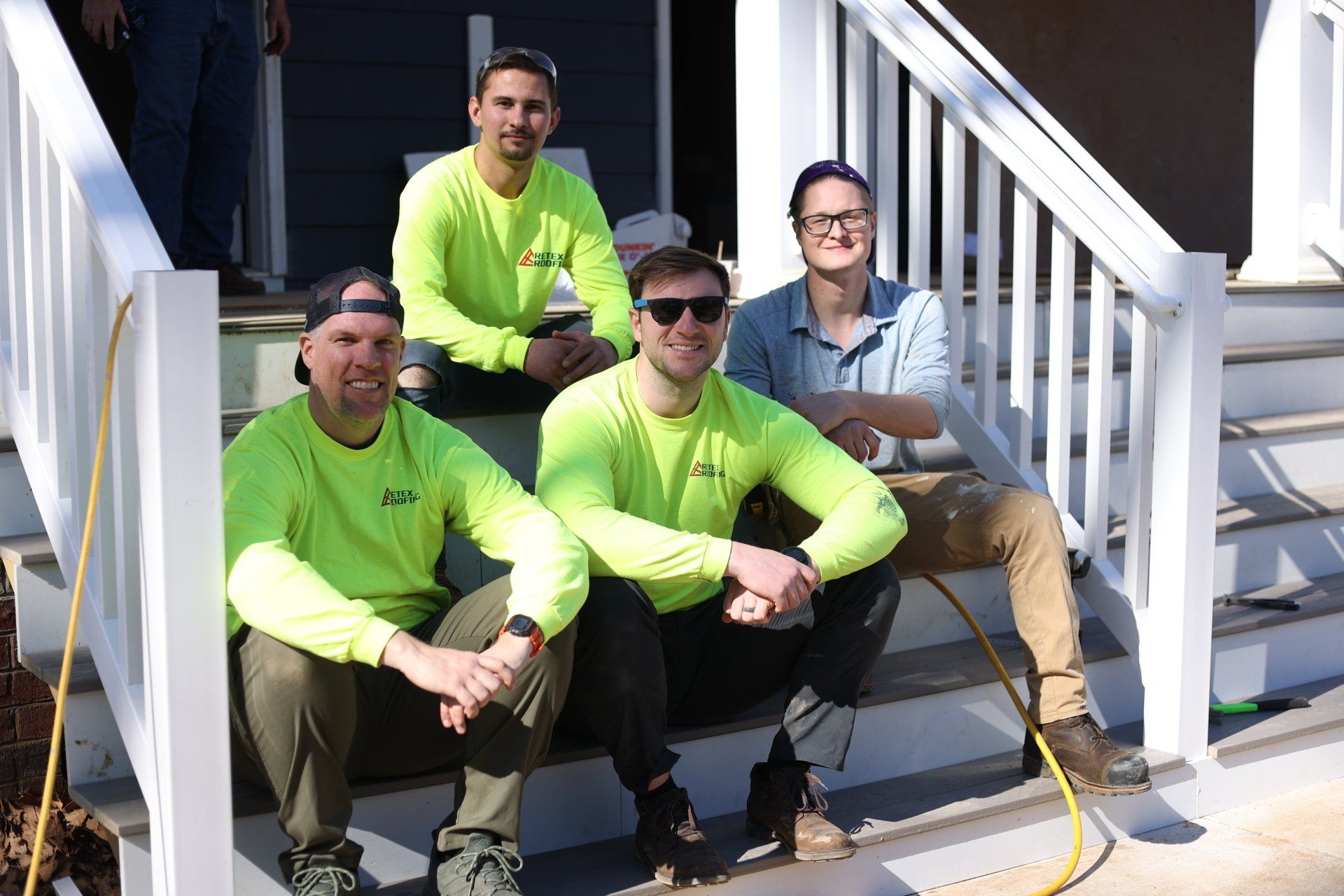 Image of RETEX's Josh Lewis, Caleb Kammerling, Mark Erickson, and Caleb Hennon at Richmond Habitat for Humanity job site.
