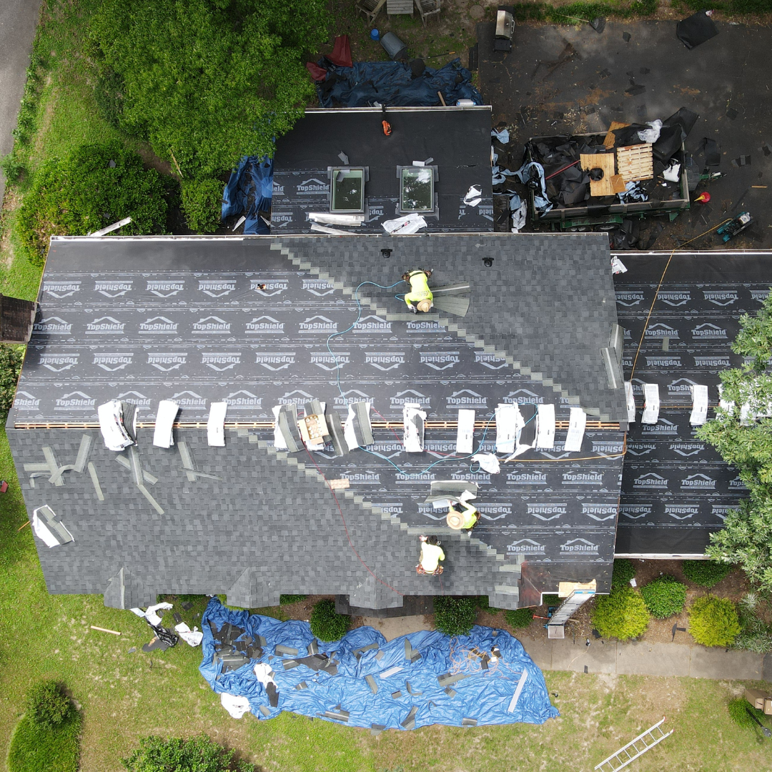 A drone image of a RETEX roof replacement in North Chesterfield VA 23235. Image shows shingle installation step.