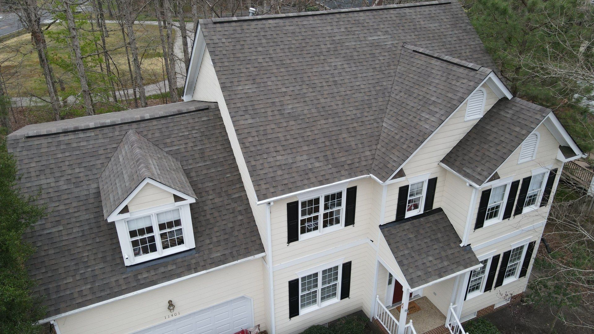 Drone image of front a home. Retex Roof Replacement.
