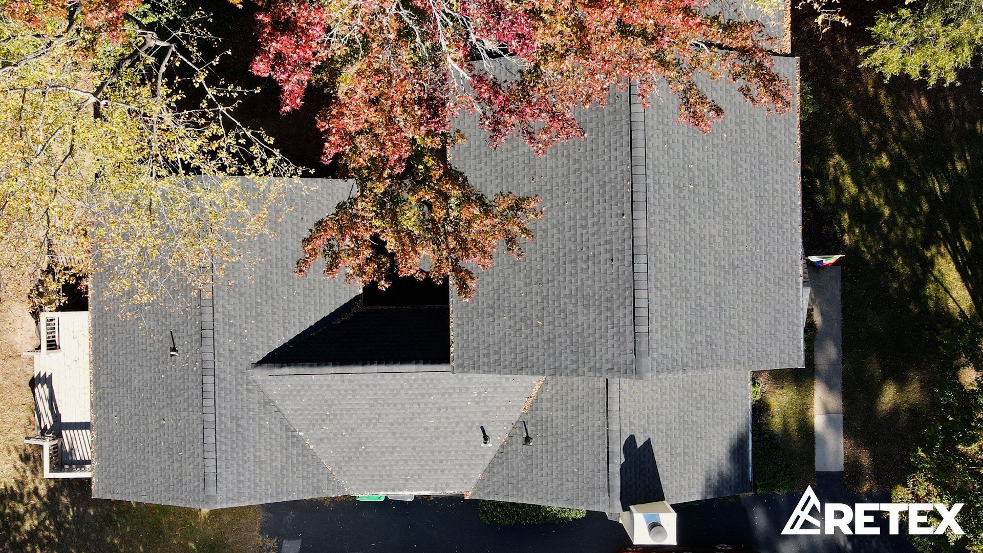 A drone image of a RETEX asphalt shingle roof replacement in Petersburg, VA. GAF Timberline Charcoal shingles.