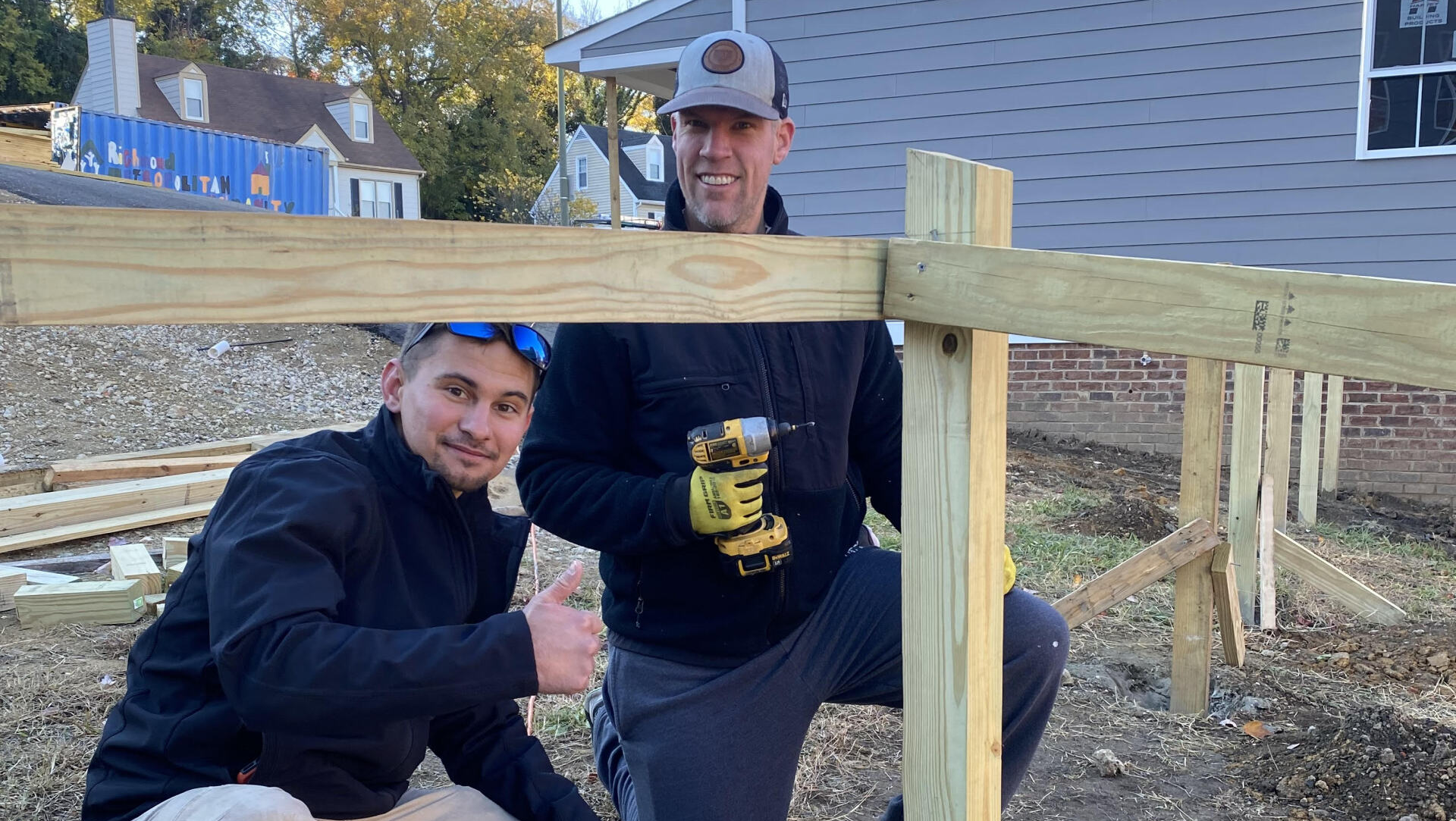 Image of RETEX’s Caleb Kammerling and Mark Erickson volunteering with Richmond Habitat for Humanity in November 2021.