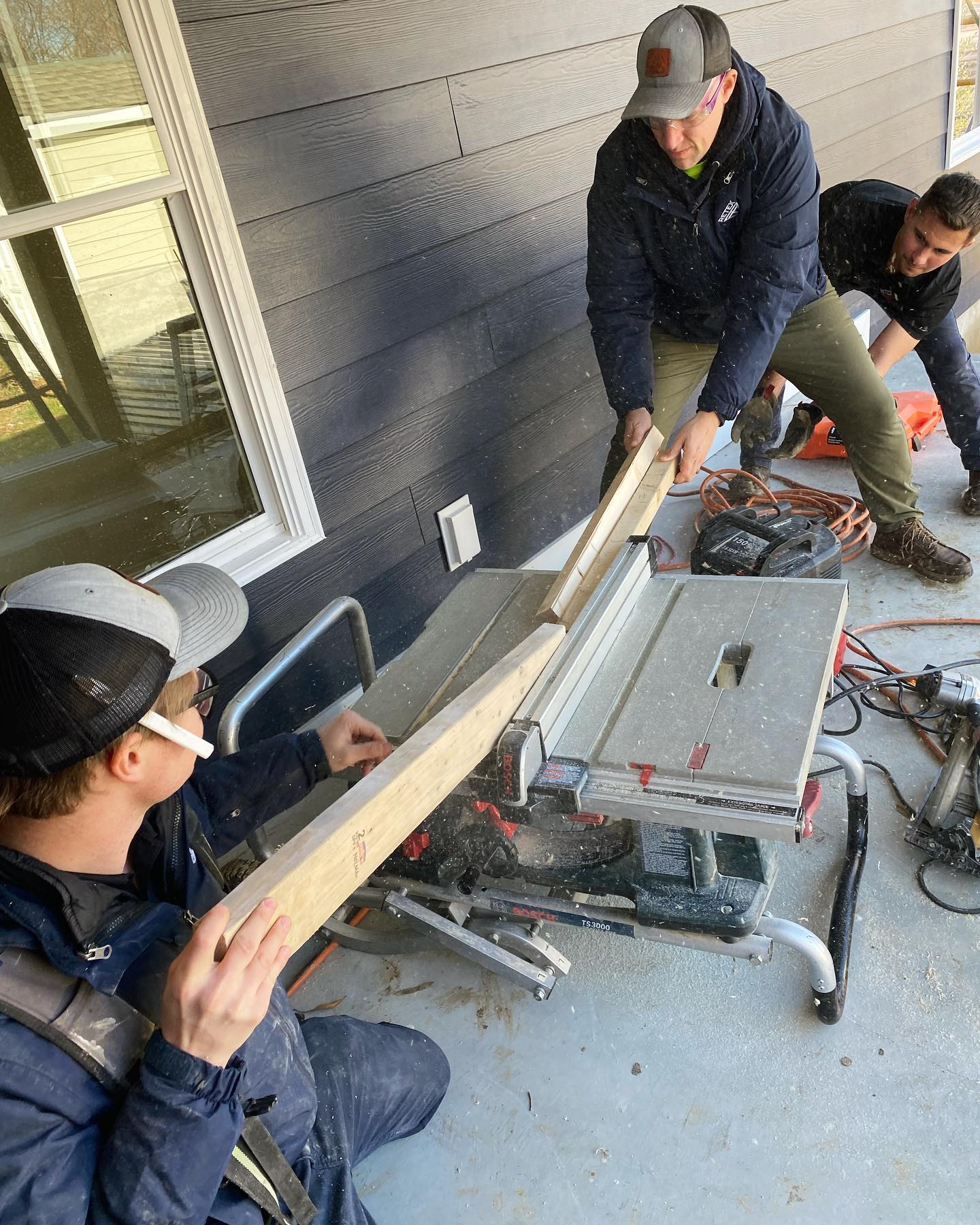 Image of RETEX’s Caleb Hennon and Josh Lewis volunteering with Richmond Habitat for Humanity in December 2022.