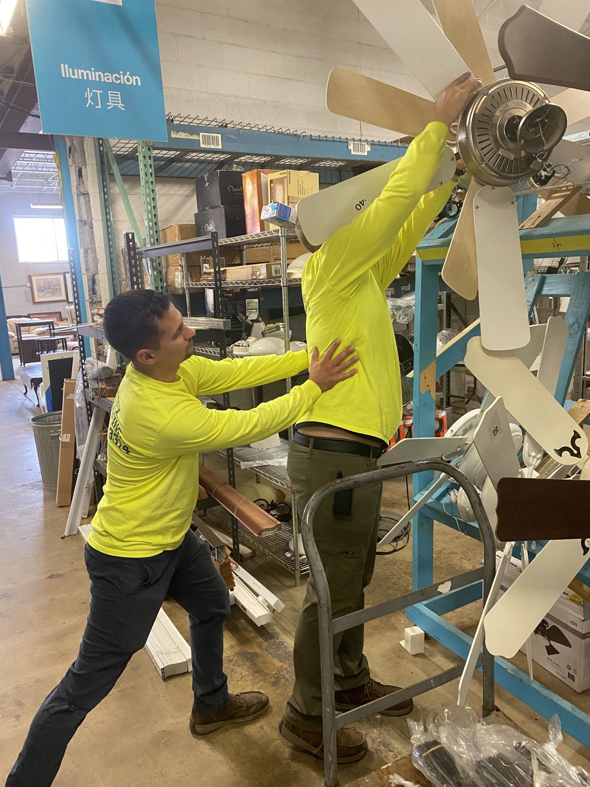 Image of RETEX's Caleb Kammerling and Mark Erickson volunteering at Habitat for Humanity's Midlothian ReStore.