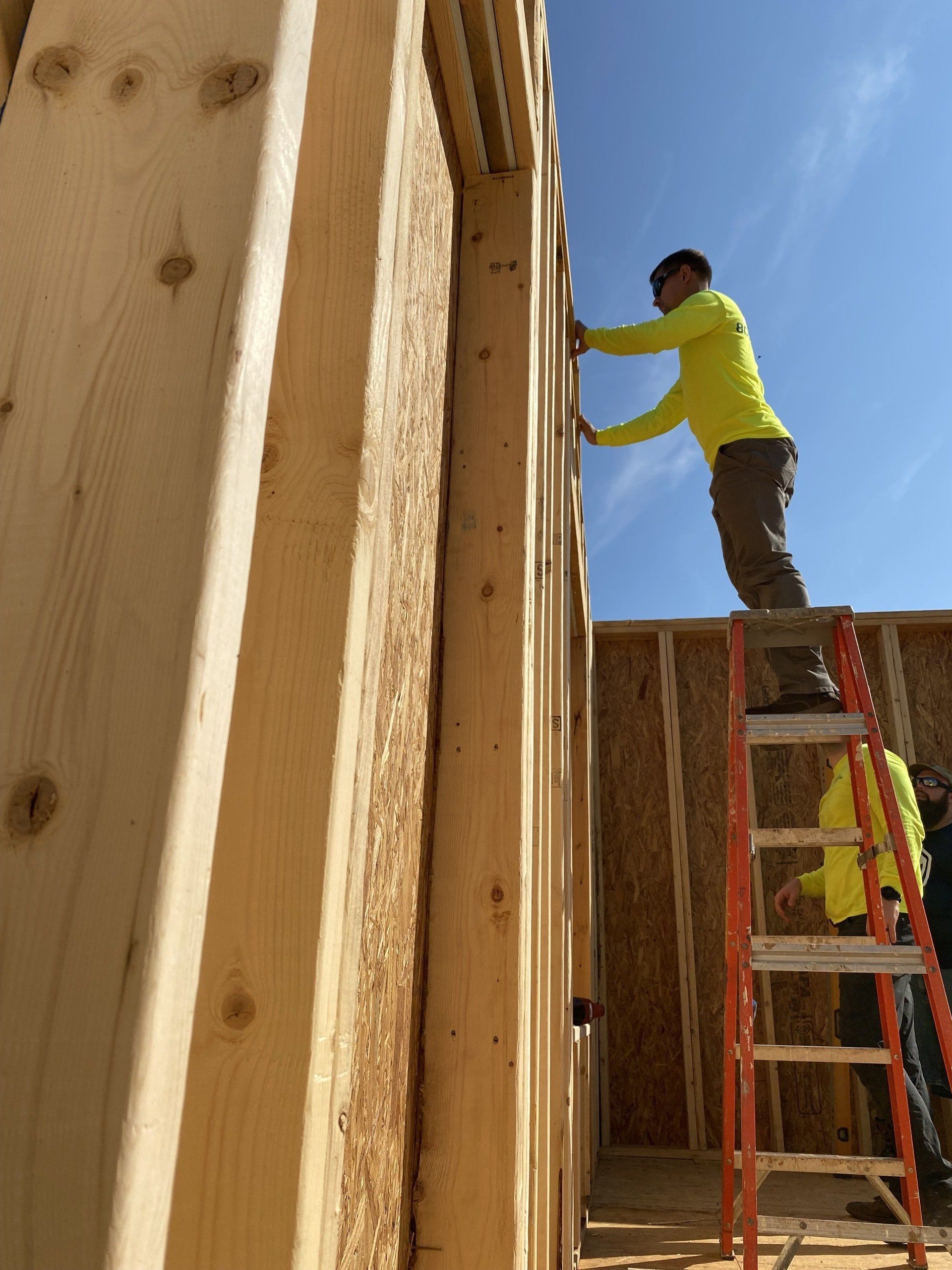 Image of RETEX's Josh Lewis and Caleb Kammerling building out framing for a Richmond Habitat for Humanity home.