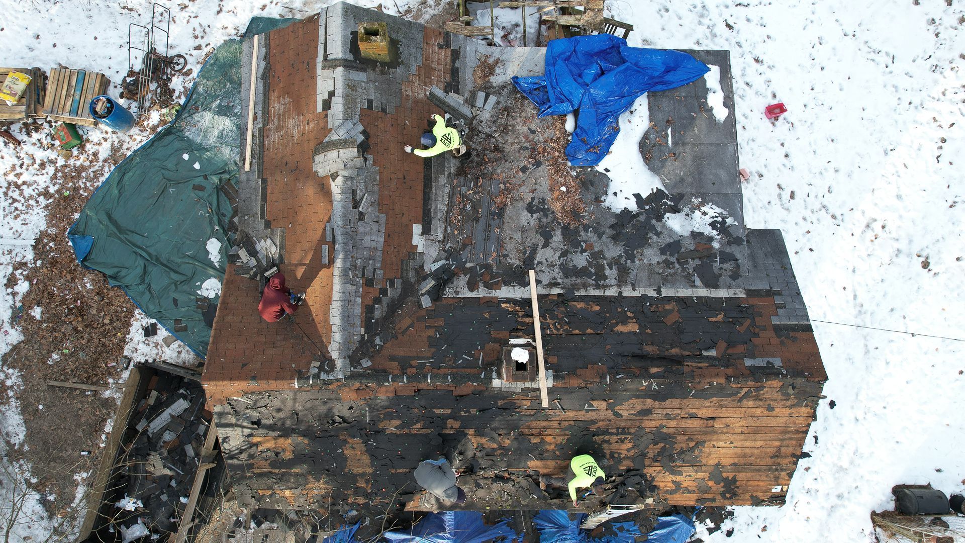 Aerial photo mid-roof tear-off for Spotsylvania Roof for a Veteran recipient Daniel Carver.
