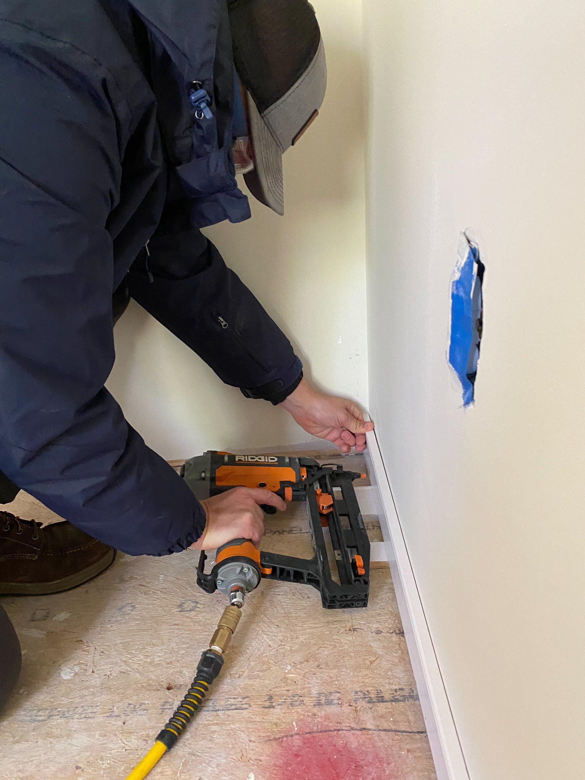 An image of RETEX's Mark Erickson installing trim during a Richmond Habitat volunteer day in November 2022.