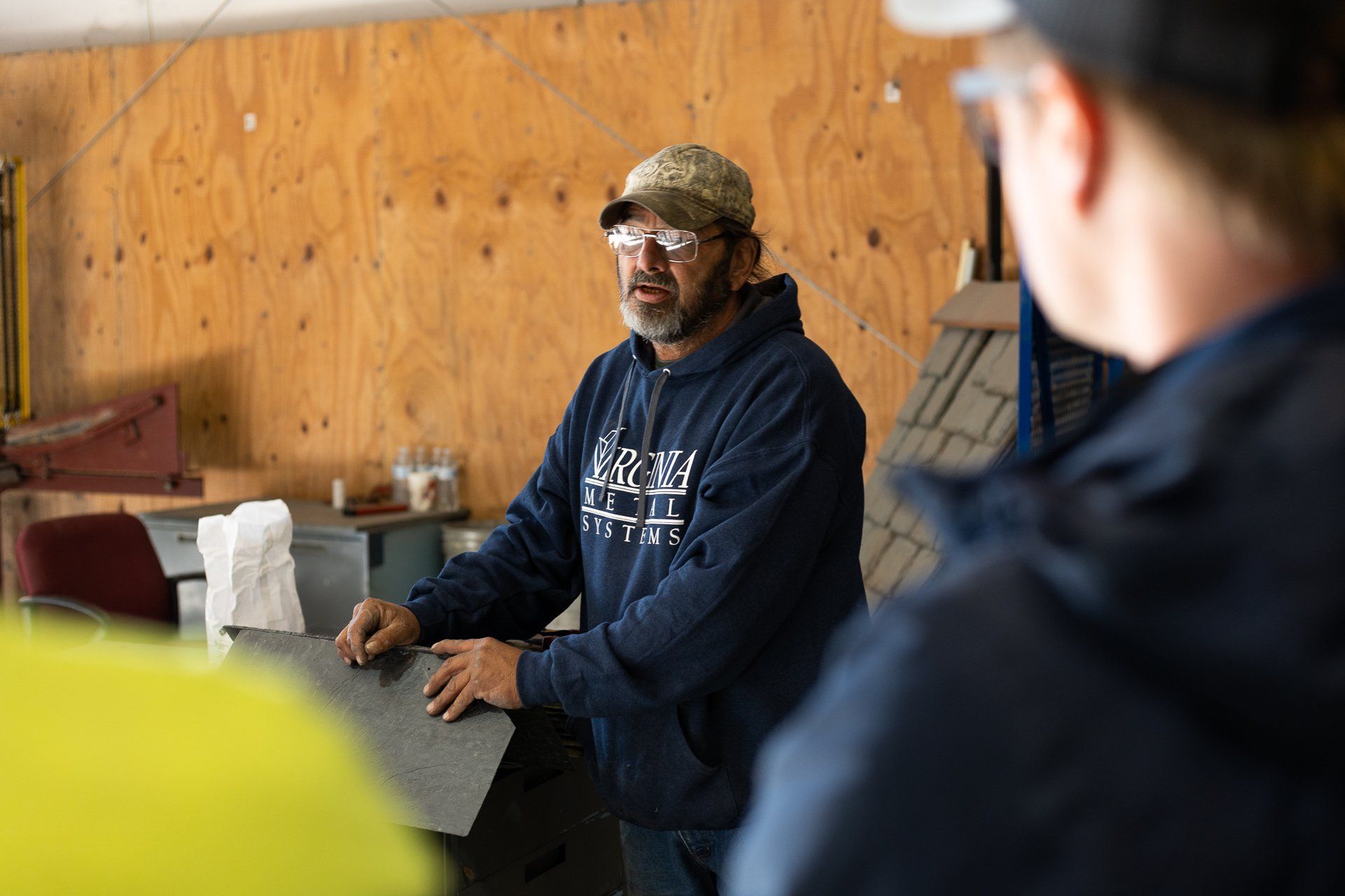 An image of a Virginia slate manufacturer's employee discussing natural slate during a team training event.