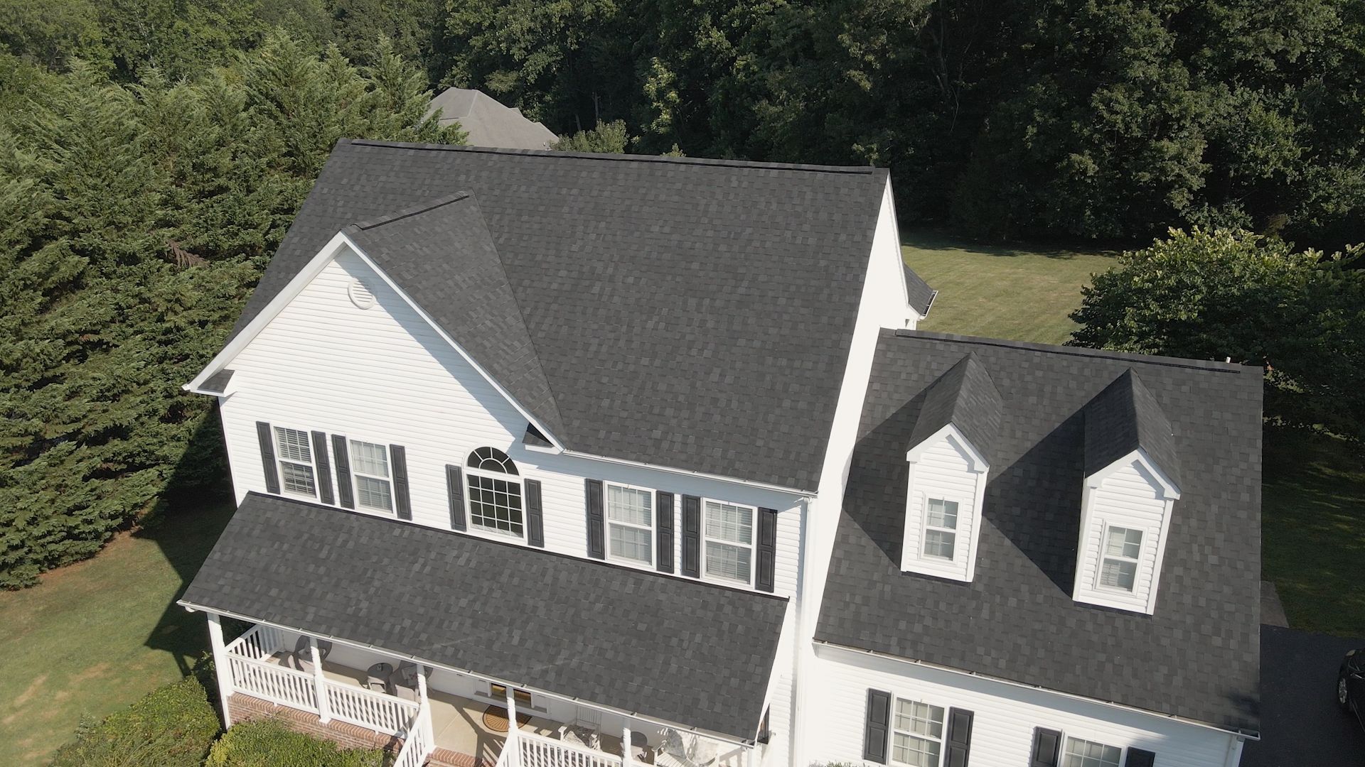 Image of RETEX roof replacement in Midlothian VA 23112. Tamko Heritage Rustic Black architectural asphalt shingles.