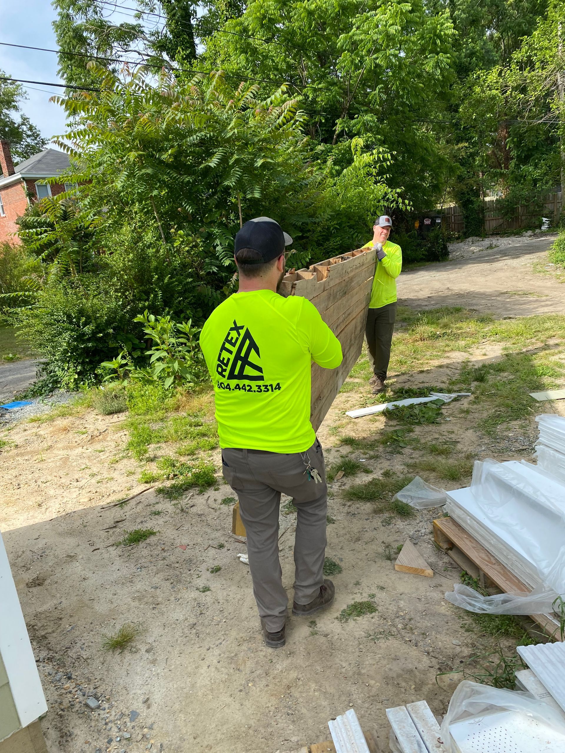 Image of RETEX’s Mark Erickson and Andy Connor volunteering with Richmond Habitat for Humanity in May 2023.