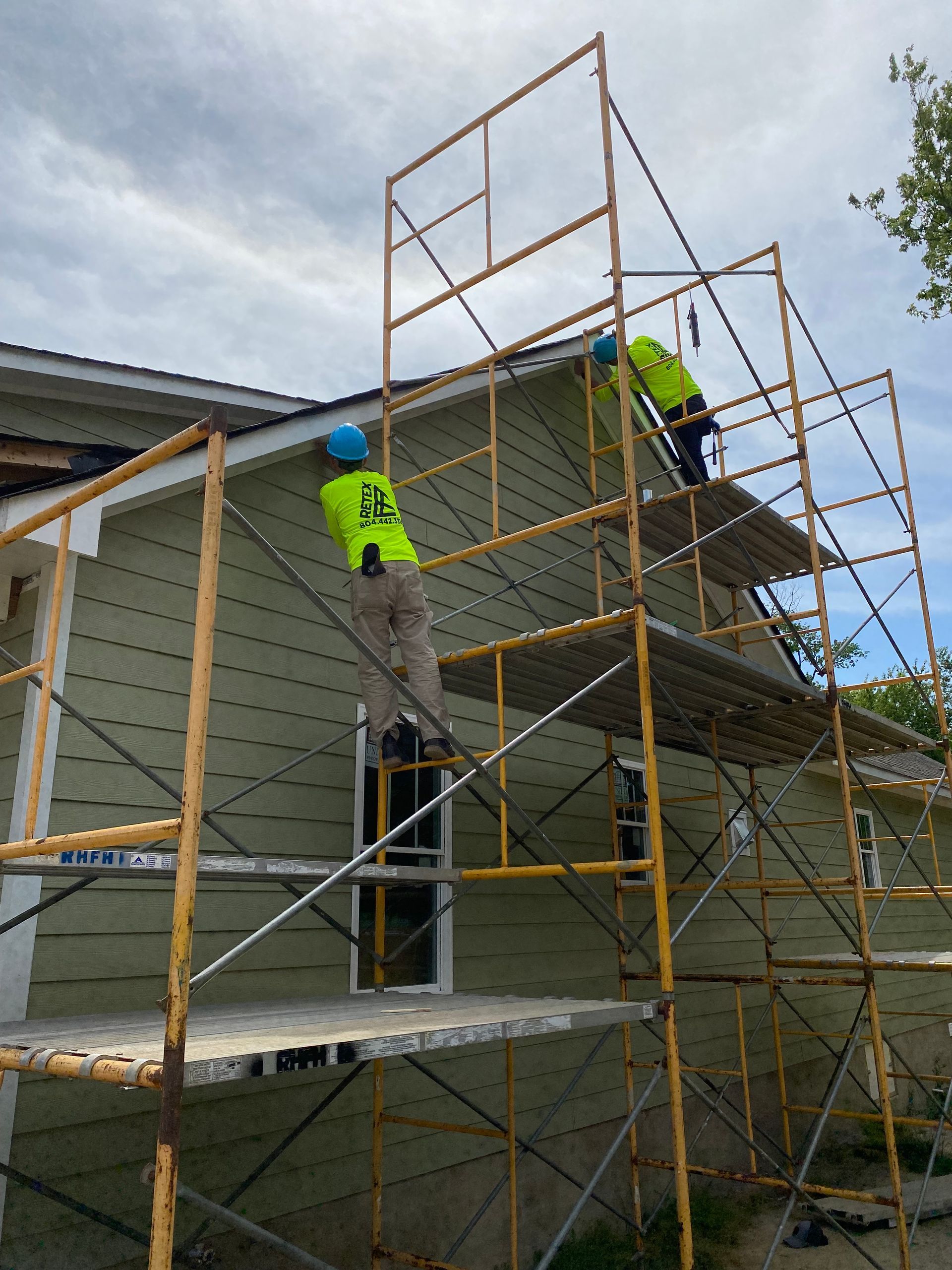 Image of RETEX team members at Richmond Habitat for Humanity job site during our RETEX team volunteer day in May 2023.