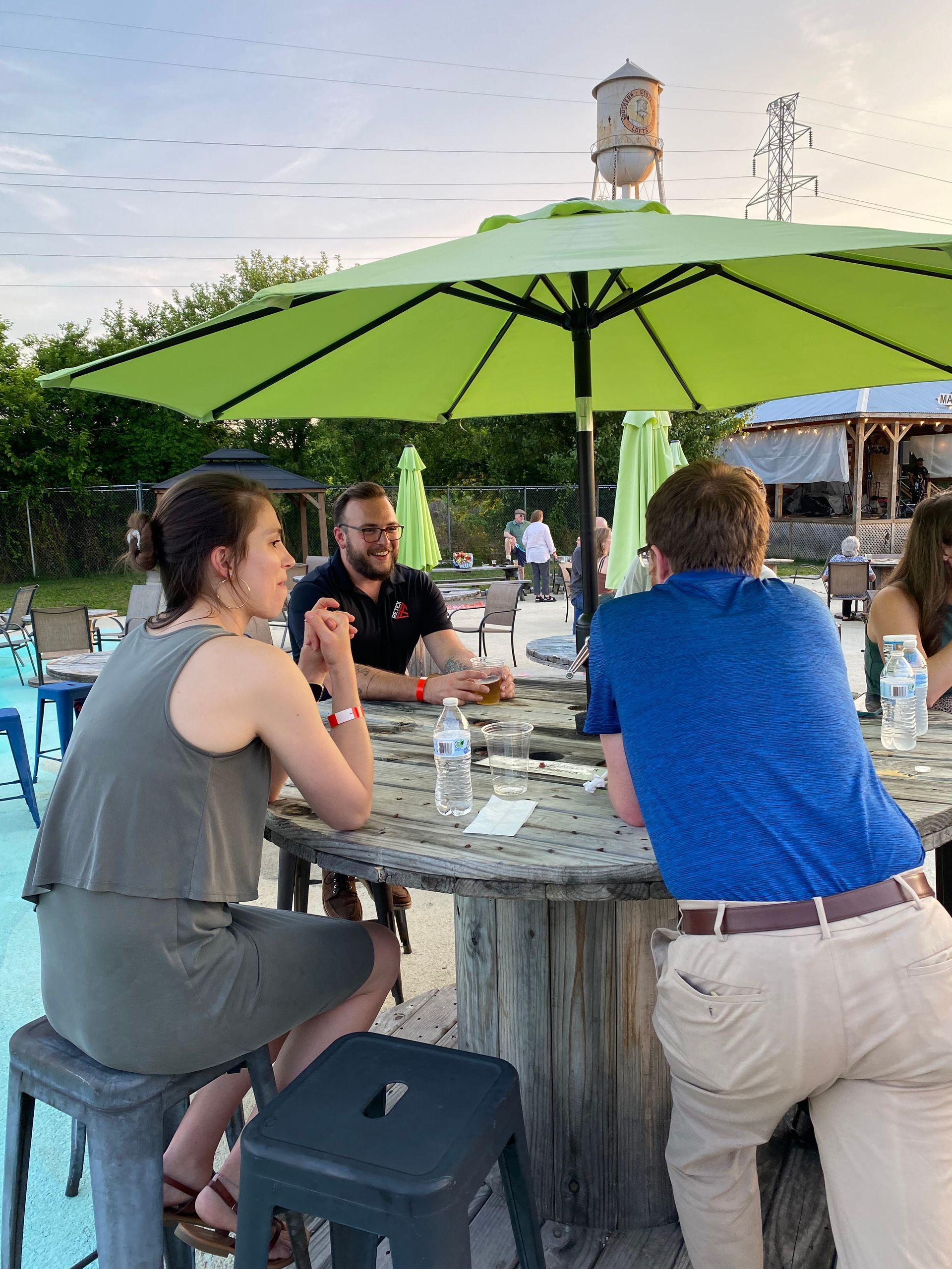 An image of RETEX's Andy Connor chatting with past clients at our June Client Appreciation event in 2023.