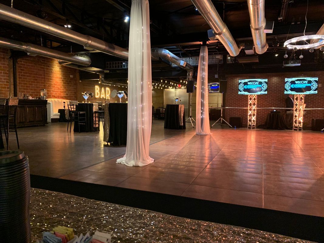 There is a dance floor in the middle of the room.