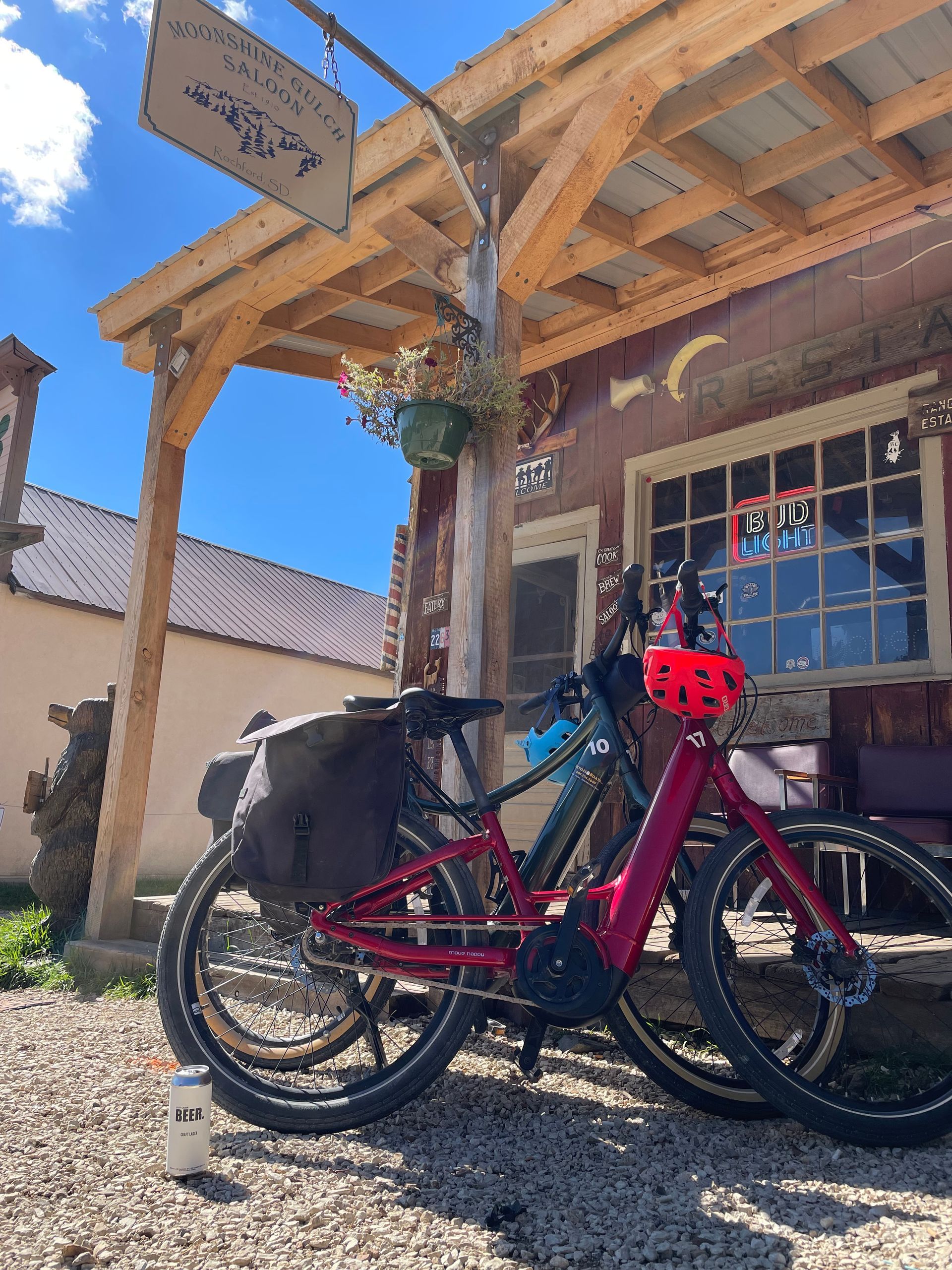 two bicycles are parked in front of Moonshine Gulch Saloon.