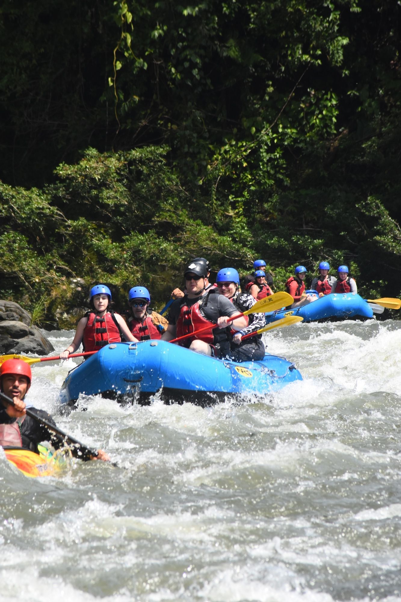 A group of people are rafting down a river.