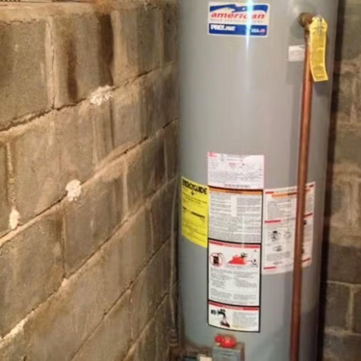 A chair with a yellow pillow and a necklace on it