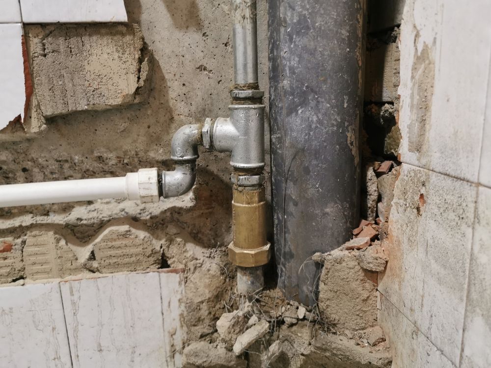 A chair with a yellow pillow and a necklace on it