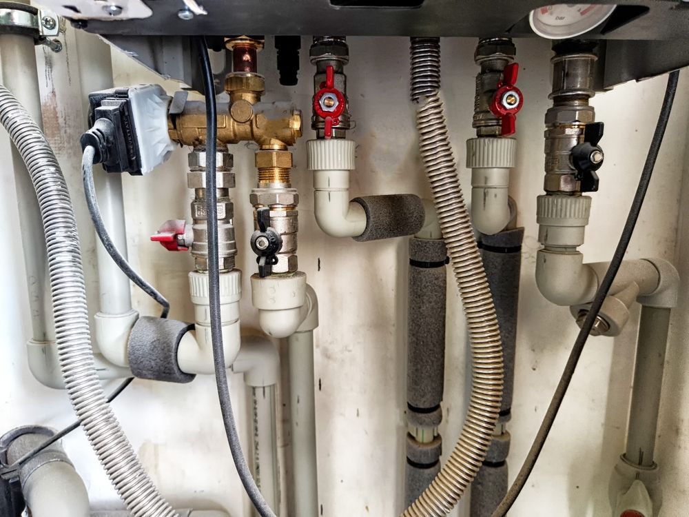 A bunch of incense sticks are sitting on top of each other on a table.