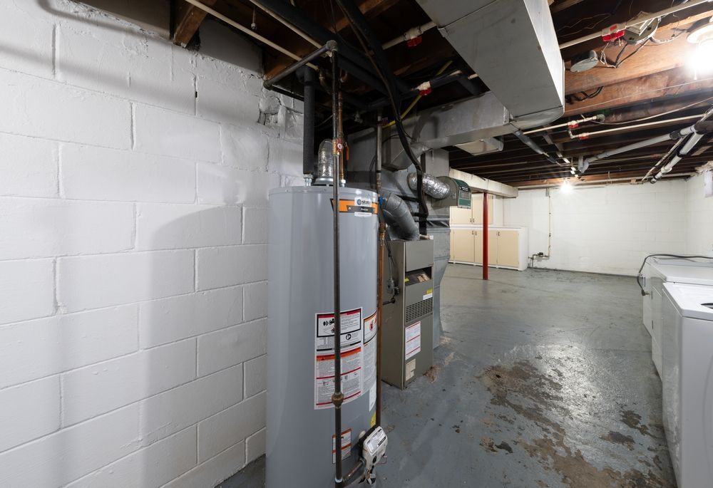 A chair with a yellow pillow and a necklace on it