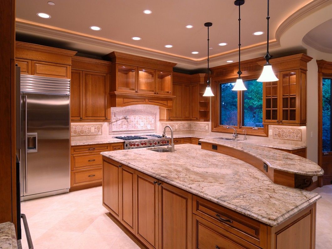 A kitchen with stainless steel appliances and granite counter tops