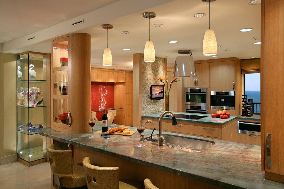 A kitchen with a large counter top and a sink