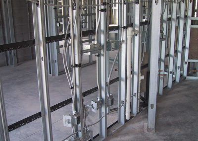 A room with a lot of metal frames and wires