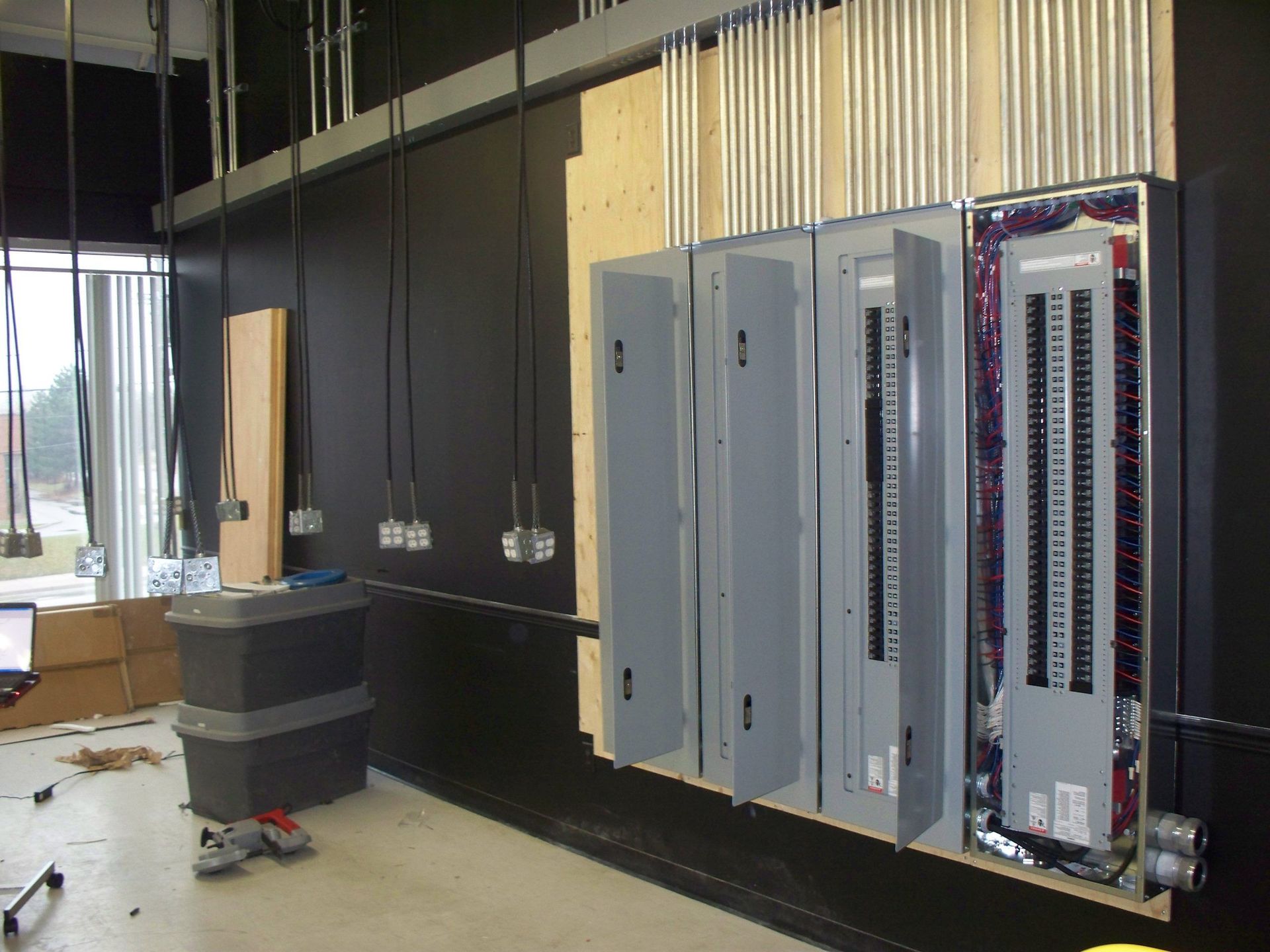 A room with a lot of electrical boxes on the wall