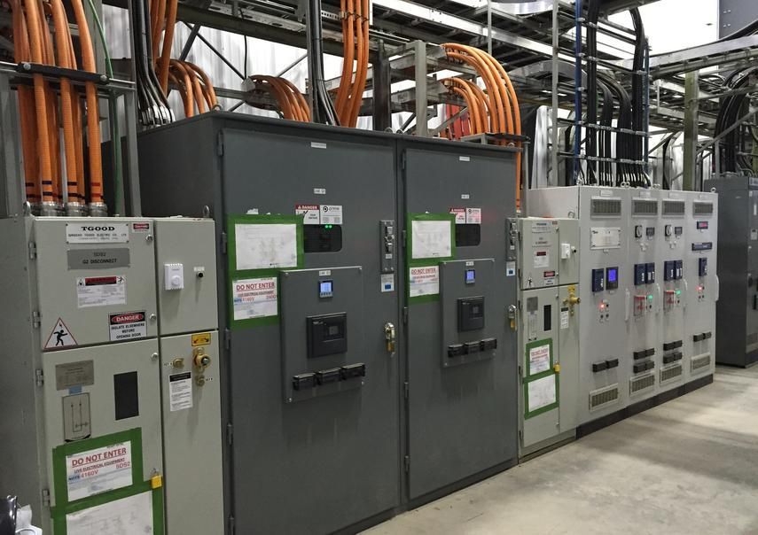 A kitchen with wooden cabinets and a large island