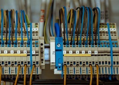 A close up of a bunch of wires connected to a electrical box.