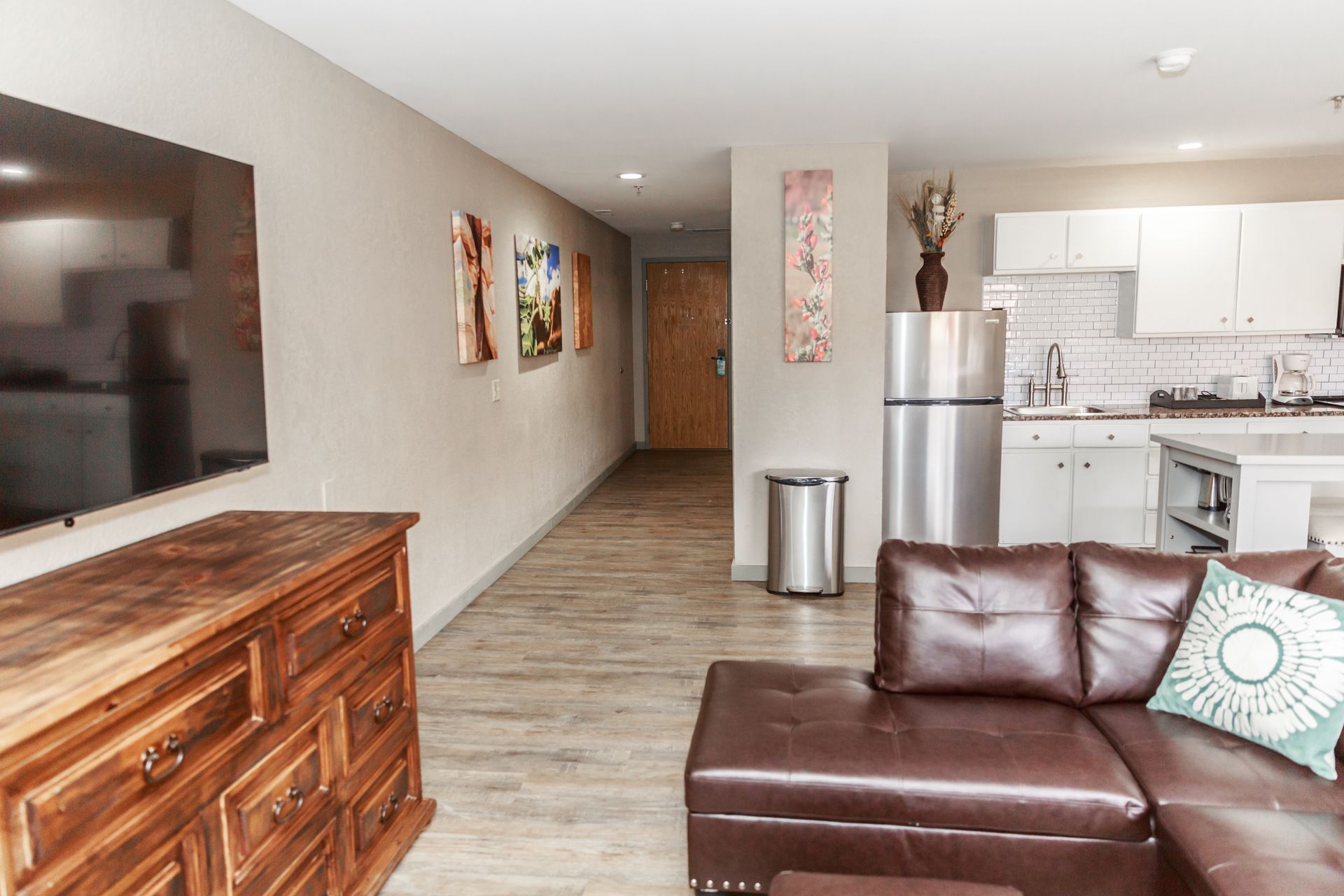 A living room with a couch and a flat screen tv