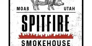 The logo for spitfire smokehouse shows two pigs standing next to each other on a white background.