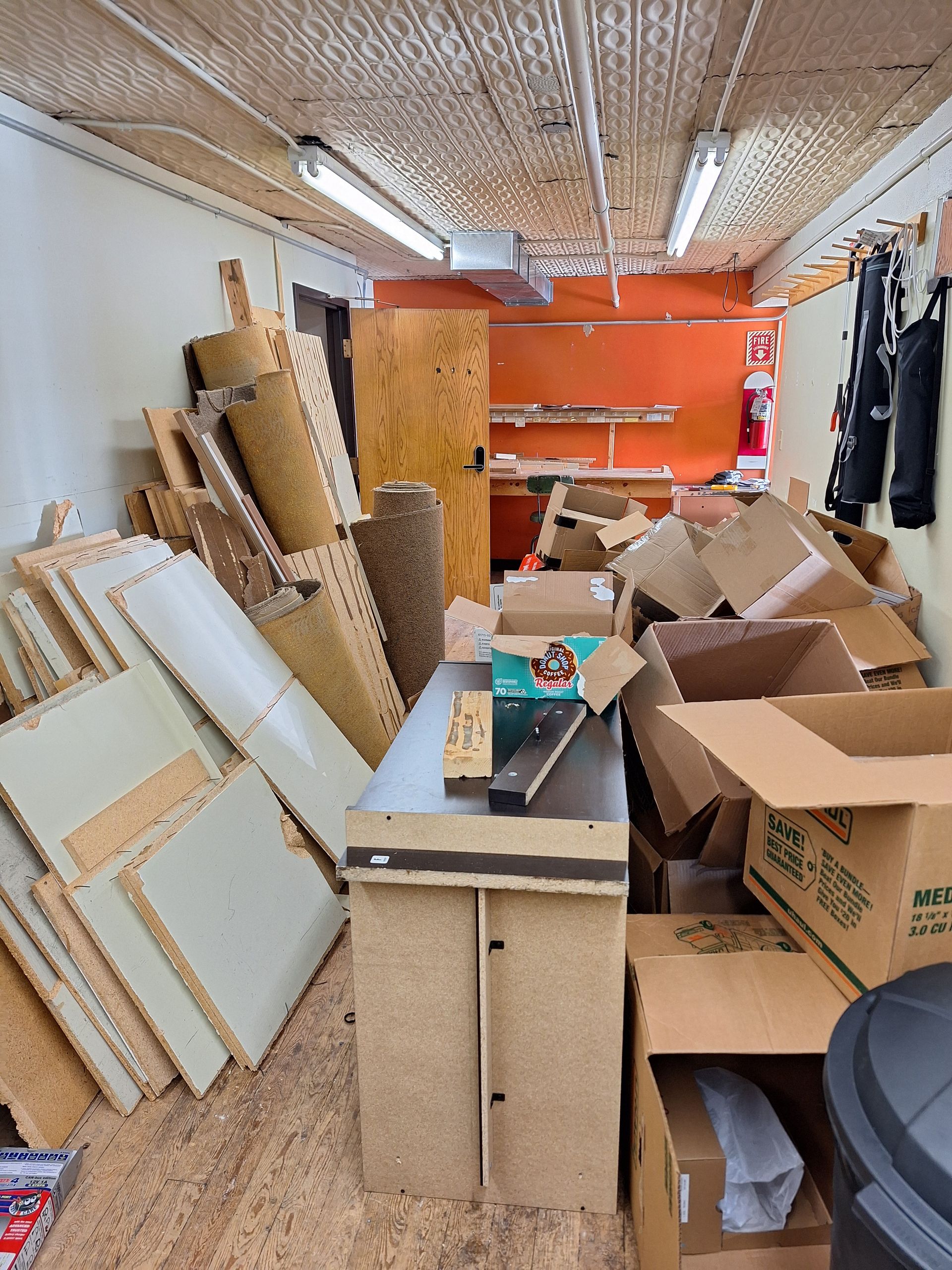 Before junk removal showing a cluttered garage