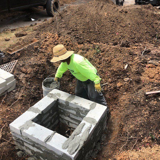 Man Working on Concrete Drainage