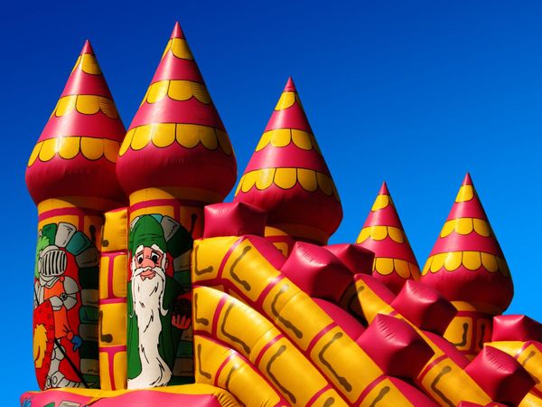 a large inflatable castle with a santa clause on it