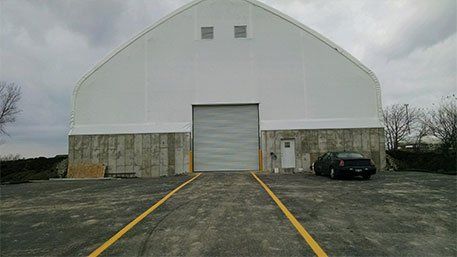 Commercial Building with Black Car in Front — Bloomington, IL — McLean County Asphalt Co.