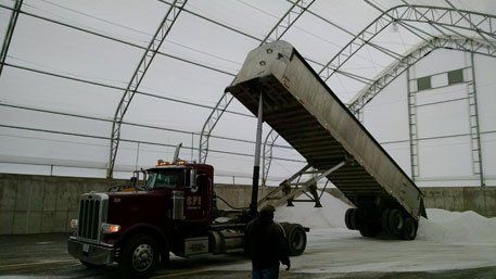 Commercial Vehicle Dropping Salt on a Stadium — Bloomington, IL — McLean County Asphalt Co.