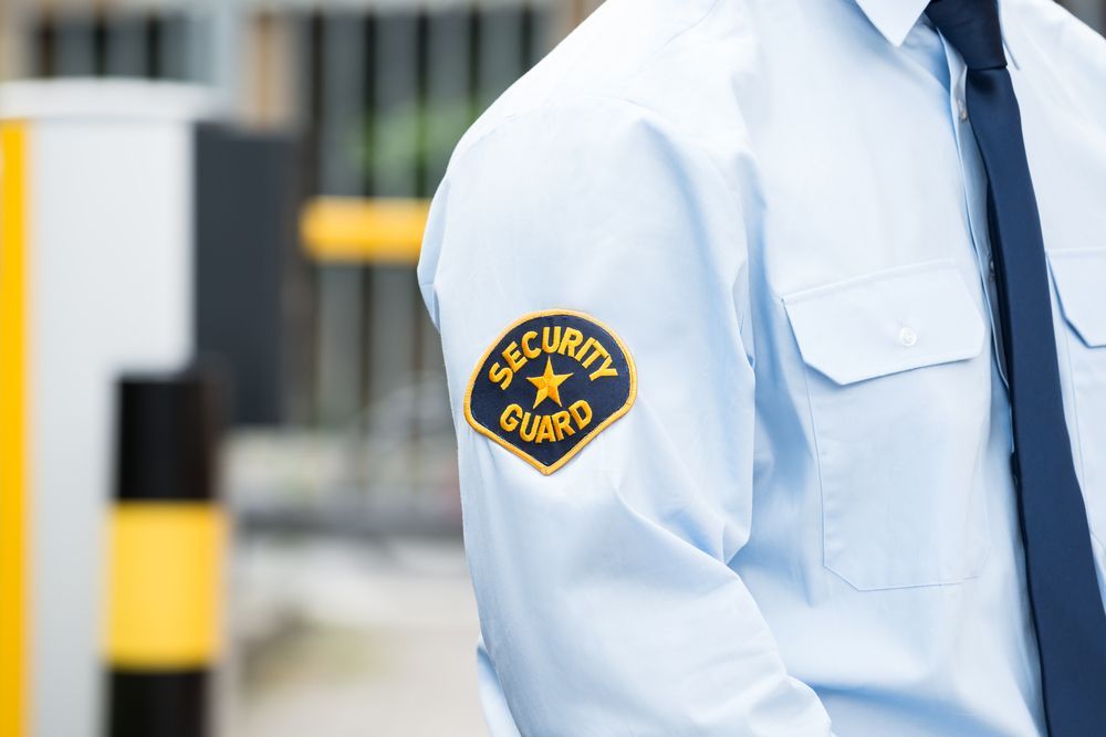 A Security Guard in Light Blue Shirt — Clinton Security Services In Dubbo, NSW
