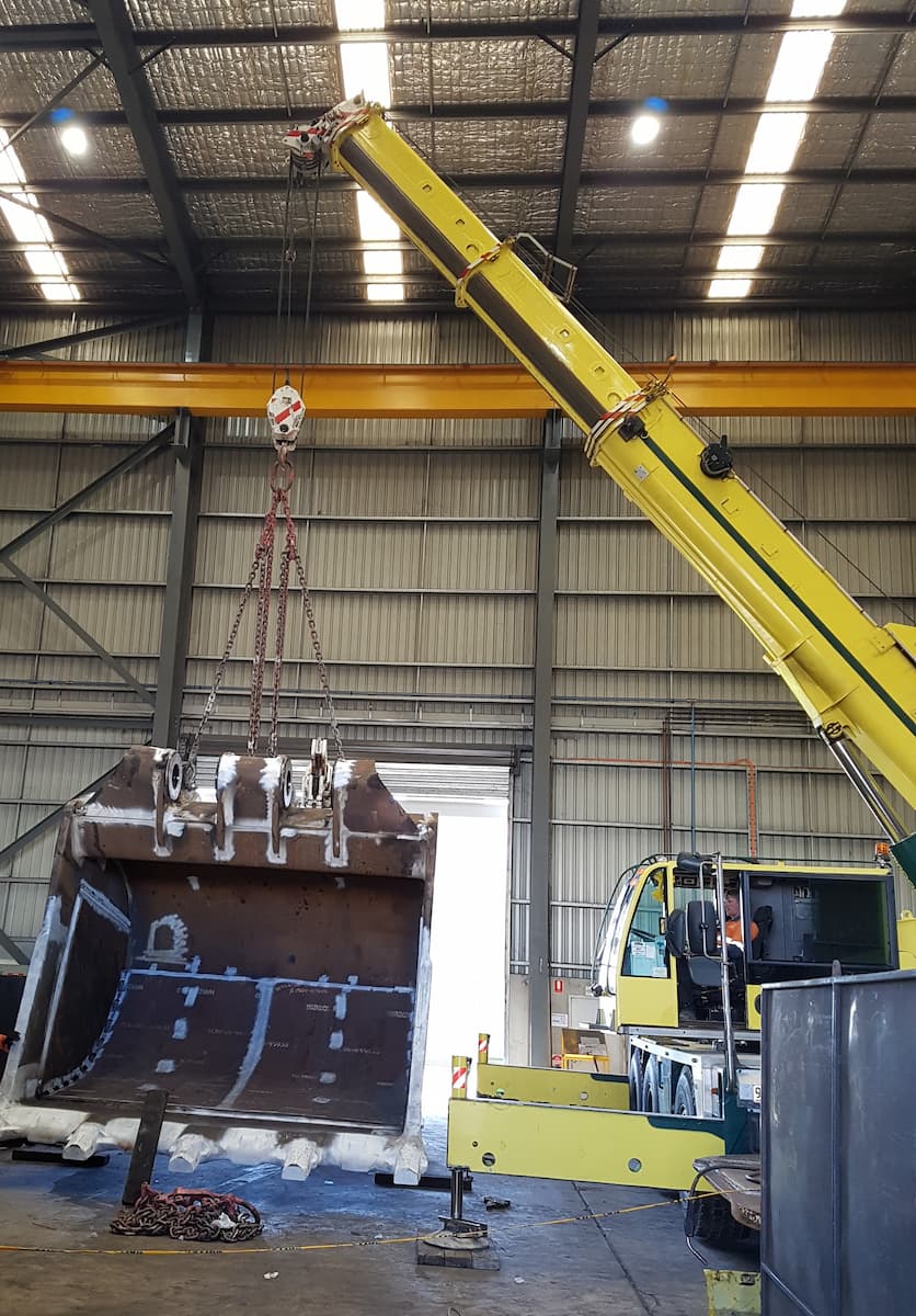 Crane Moving Large Machinery Bucket — Statewide Lift & Shift Pty Ltd In Paget, QLD