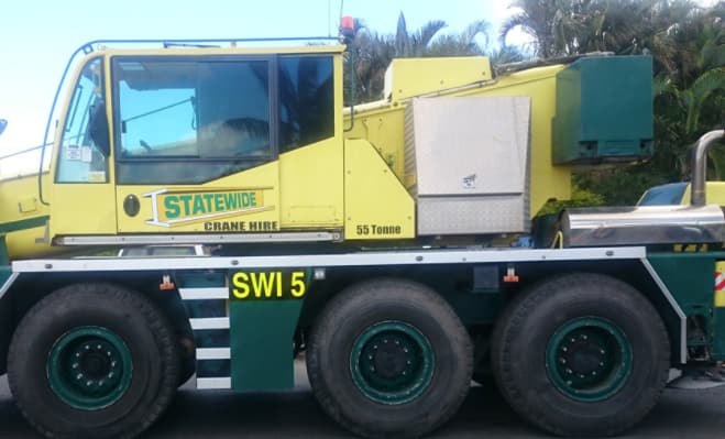A Yellow and Green Truck With the Number 5 on the Side — Statewide Lift & Shift Pty Ltd In Paget, QLD