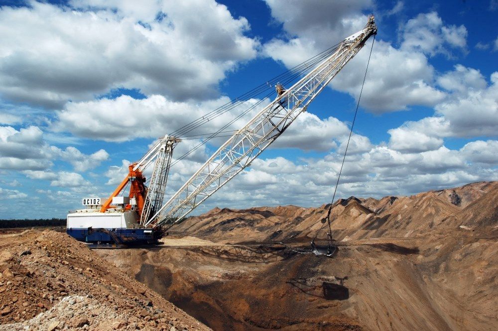 A Large Crane is Sitting on Top of a Pile of Dirt — Statewide Lift & Shift Pty Ltd In Nebo, QLD
