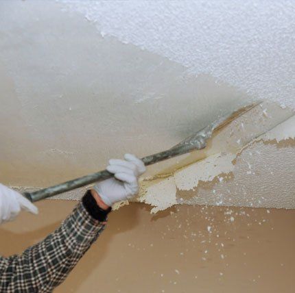 Worker Removing the Popcorn Ceiling — Clearwater, FL — Baird Quality Painting