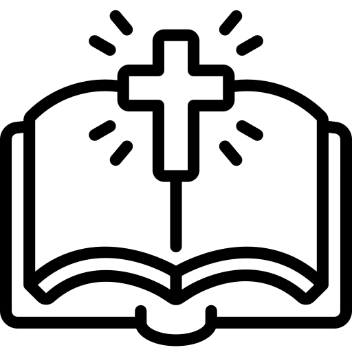 An open bible with a cross on top of it.