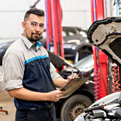 Tire Service — Mechanic Inspecting A Car in Morton, PA