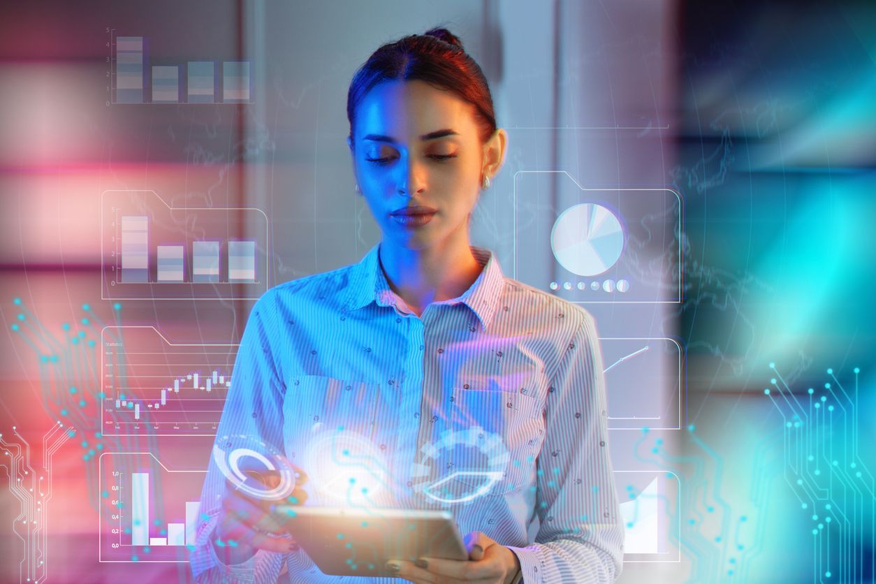 Experte analysant des données et graphiques IA sur tablette pour la stratégie de gouvernance et formation Extensio.ai.