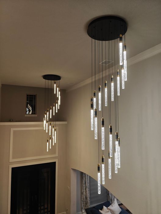 A room with a lot of lights hanging from the ceiling