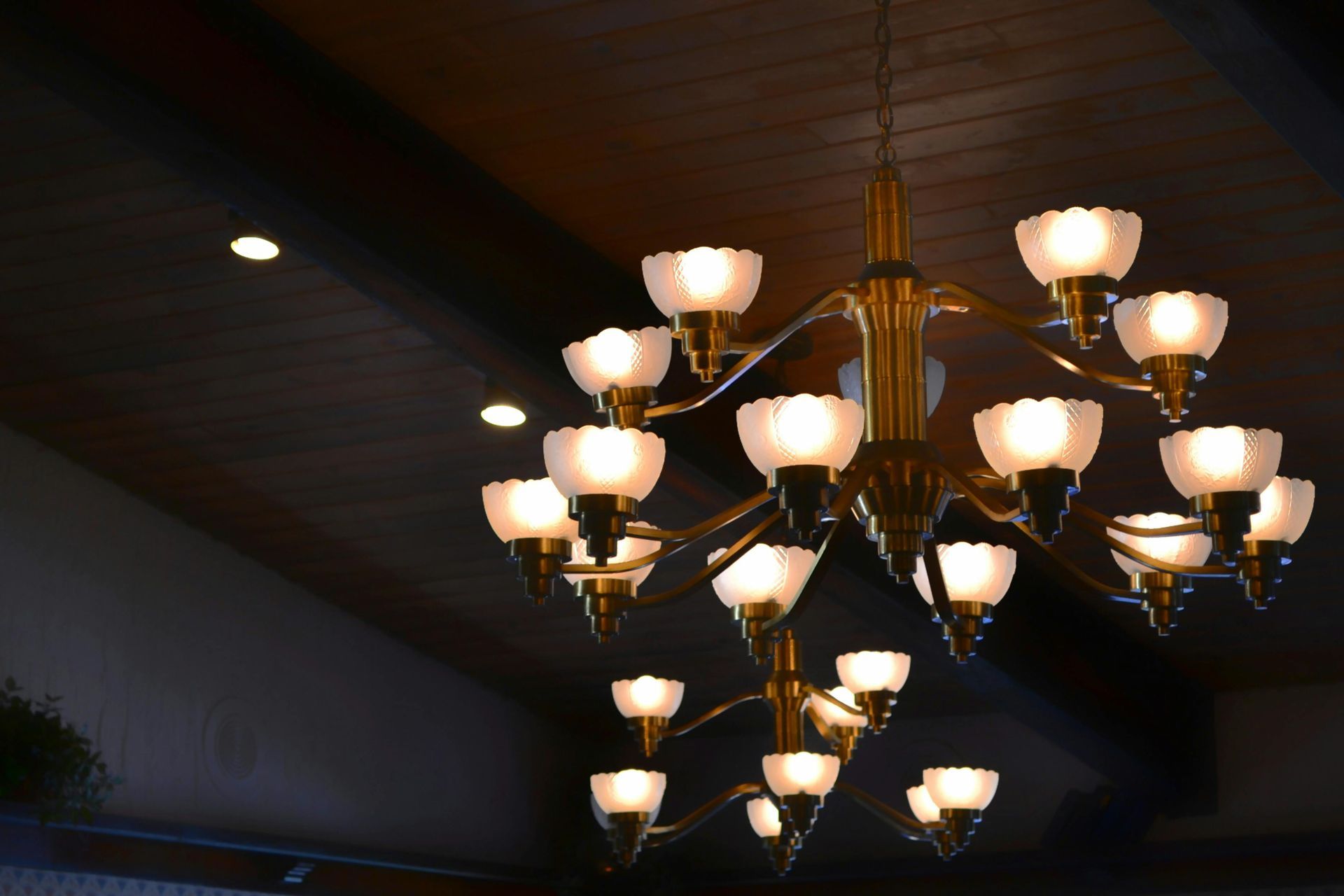 A chandelier with many lights hanging from the ceiling