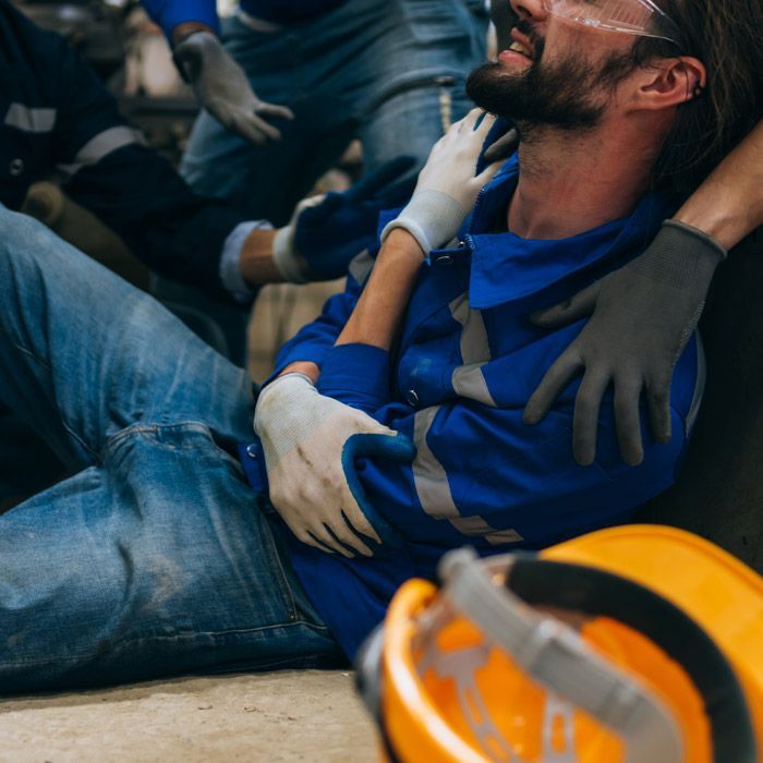A man is working on a machine in a factory.